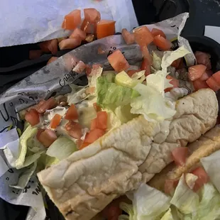 Cheesesteak sub with chopped tomatoes