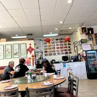 people sitting at a table in a restaurant