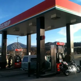 Pumping gasoline.