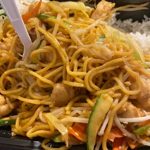 a plate of noodles and vegetables