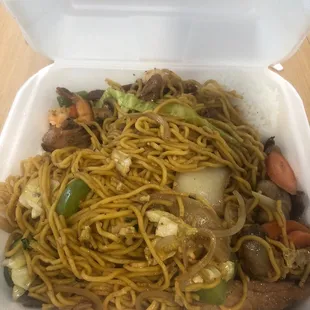 a close up of a meal in a styrofoam container