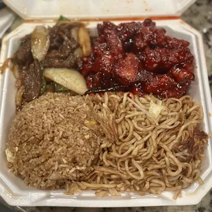 Mongolian beef, orange chicken combo with half rice half chow mein. Generous portions!