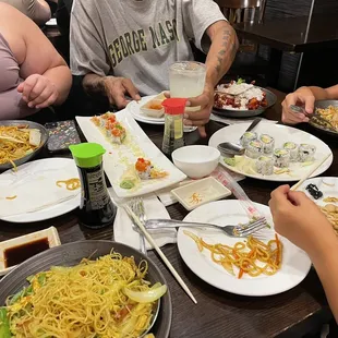 a group of people eating at a restaurant