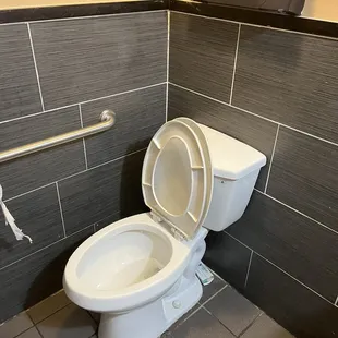 a toilet in a public restroom