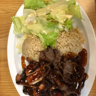 Chicken and beef teriyaki with brown rice.  The meats are both juicy. Sauce is on the sweet side.