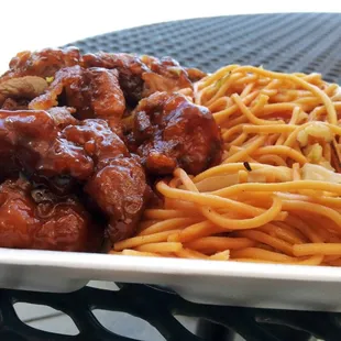 a plate of spaghetti and meat