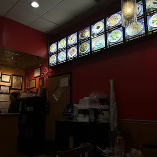 a restaurant with menus on the wall