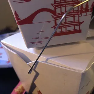 a pair of scissors cutting a box