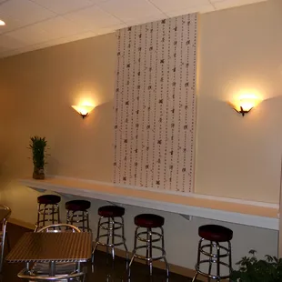 a row of stools in a restaurant