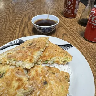 Chicken egg foo young over rice.