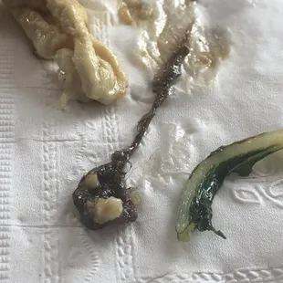 Found this in my food.... A wet long hair ball and it's not the first time.. All of the cooks have long hair and beards.