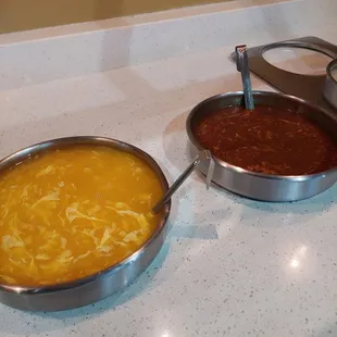two pans of food on a counter