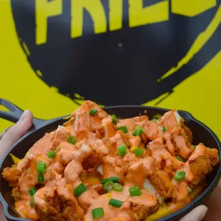 a person holding a bowl of food