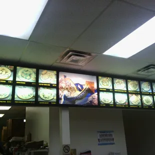 Old skool Chinese takeaway sign complete with faded stock photos