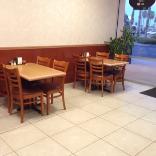 a restaurant with tables and chairs