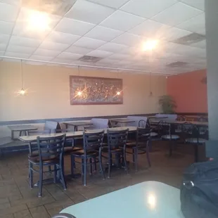 a restaurant with tables and chairs