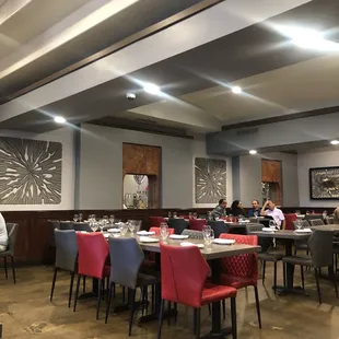 a dining room with tables and chairs