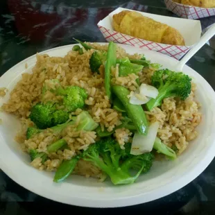 a plate of rice and broccoli