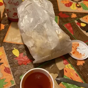 a cup of tea and a spoon