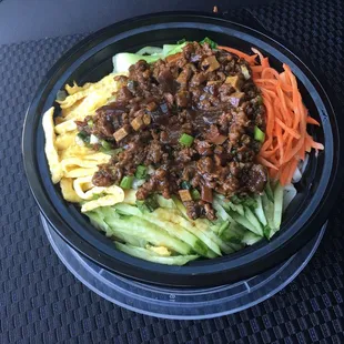 Ju-jang mein-  Noodles with a rich meat sauce and veggies