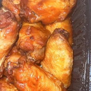 chicken wings in a plastic container