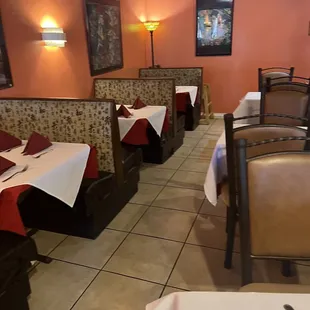 a dining area with tables and chairs