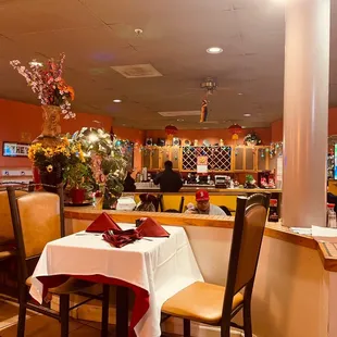 a dining area with tables and chairs