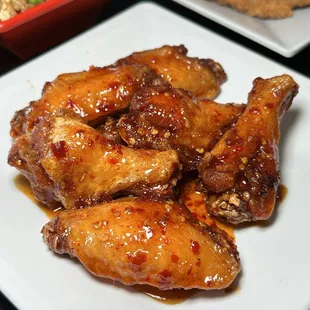 a plate of chicken wings and rice