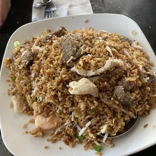 House Fried Rice  Absolutely the best. Plump, very clean shrimp along with chicken and beef.