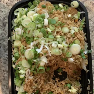 Raw green onions and shallots topped on rice-not even sautéed or cooked with the rice.