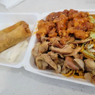 a plate of food and a roll