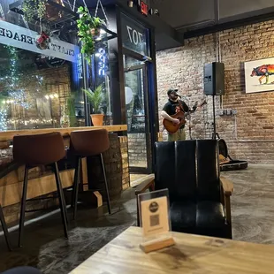 a man playing a guitar