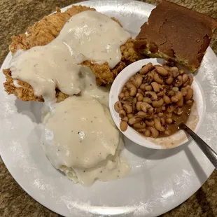 Chicken fried chicken, mash potatoes and black eyed peas served by Briana.
