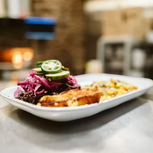 a plate of meat and vegetables