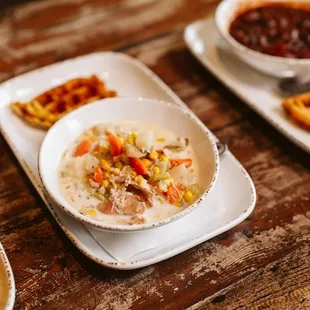 a bowl of soup and waffles