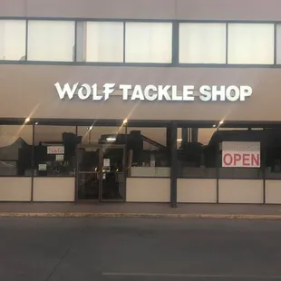 Wolf Tackle Shop storefront with new signage.