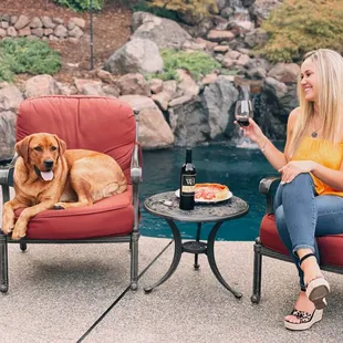 Girl and her dog drinking Wolfe Heights Cabernet wine.