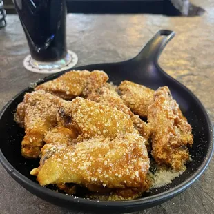 Hot garlic and parmesan wings and Irish stout.