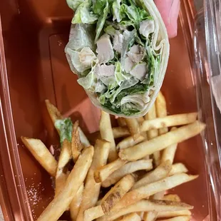 Chicken Caesar salad wrap with no tomatoes and a side of French fries