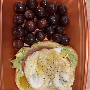 Avocado toast with egg, side of grapes