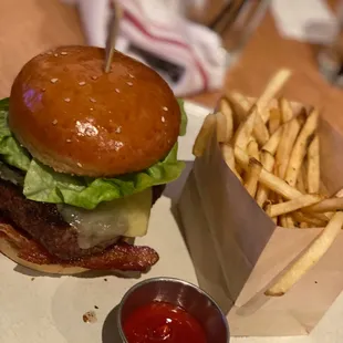 a hamburger and fries on a table
