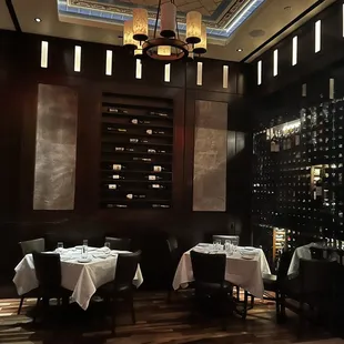 a dining room with wine racks