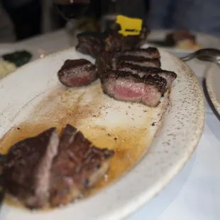 a plate of steak and mashed potatoes