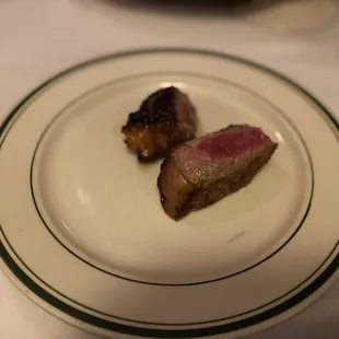 two pieces of meat on a plate