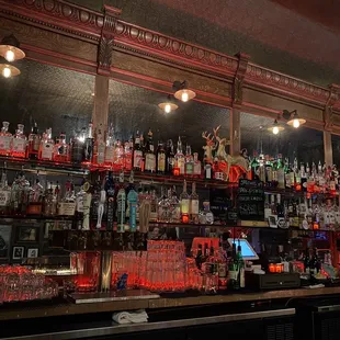 a bar filled with liquor bottles