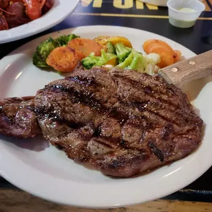 Monday night 8oz Ribeye steak special $11.99 with grilled veggies.