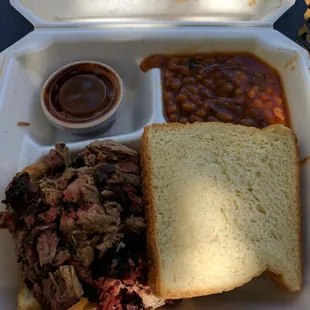 1/4 lb Chopped brisket sandwich with mild sauce and baked beans