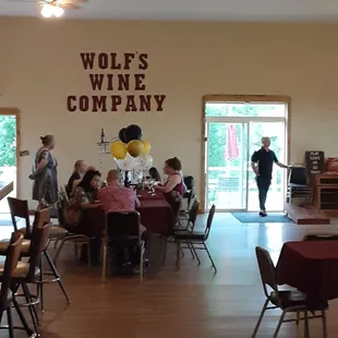 a group of people sitting at tables