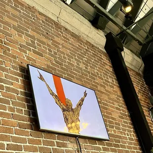 Revolving art on wall