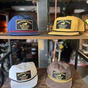 three hats on a shelf